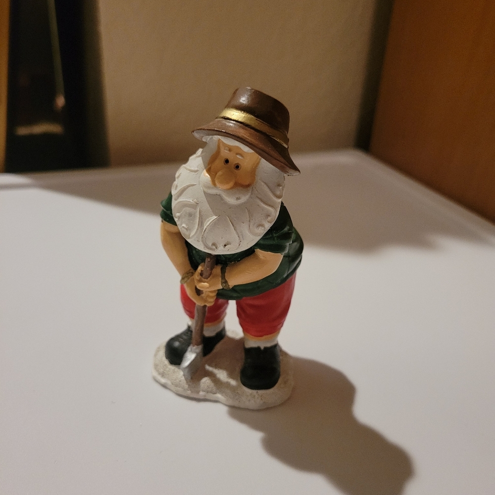 Golfing Santa Claus figurine